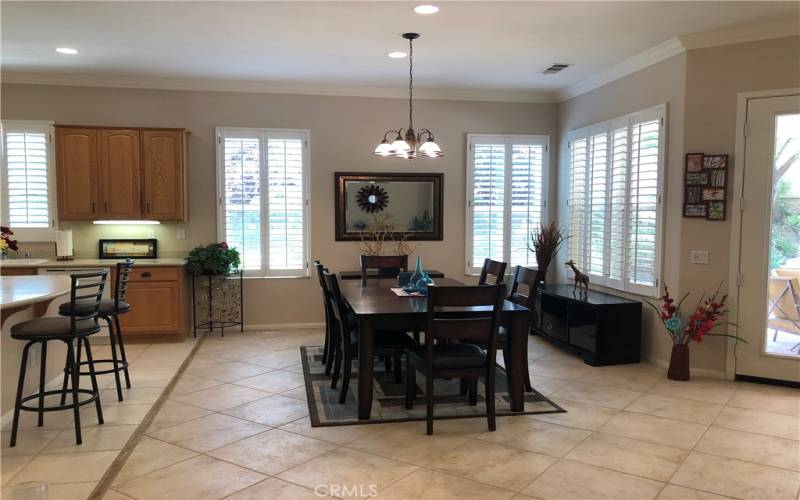 Dining Room is Light and Bright with all that Natural Sunlight entering the space from all those windows