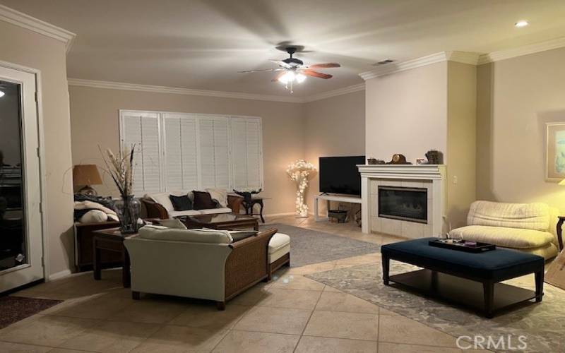 Living Room with Tiled Floors and Fireplace. Those are 10' Ceilings with Crown Moulding.