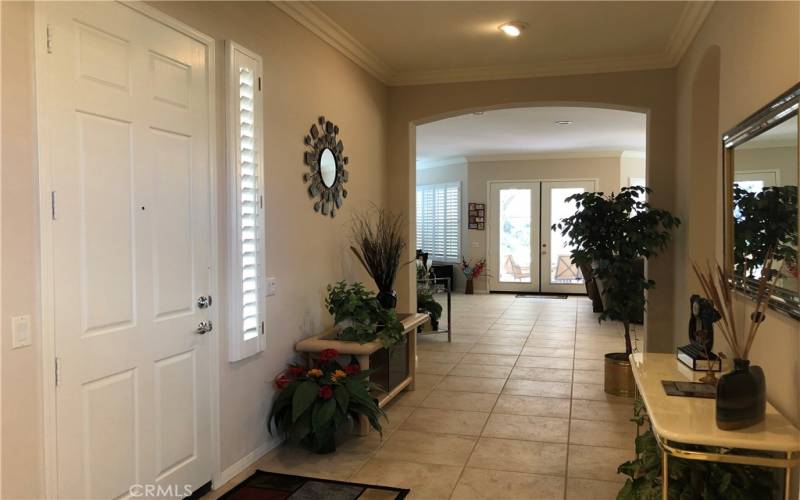 Formal Entry and farther back are two French Doors leading to Back Yard.