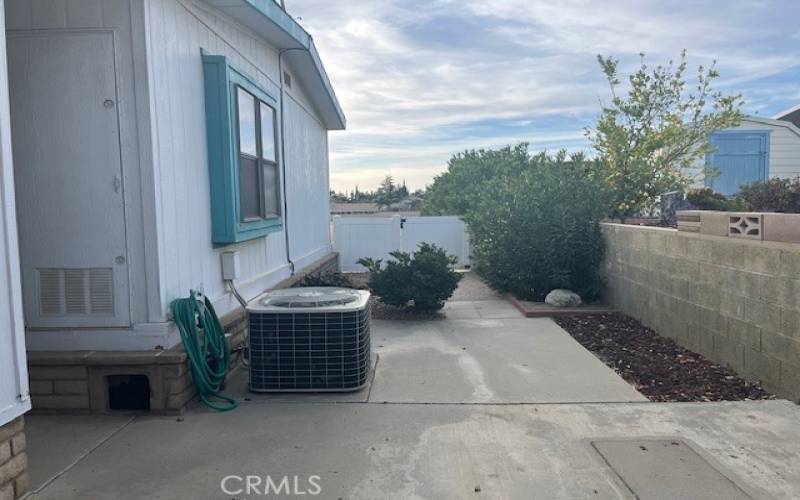 Rear Concrete Patio and A/C Unit