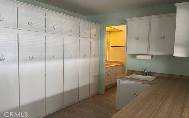 Wall-to-Wall Cabinets in Laundry Room and Wash Sink