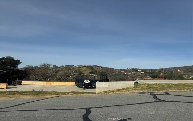 a straight on view from the road. The house will be built on a downslope, however remember it is three stories.