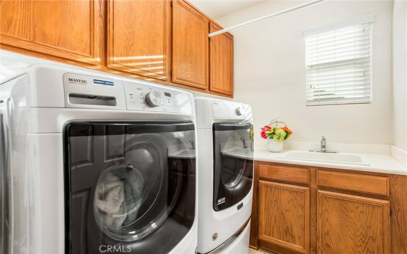 Upstairs laundry with lots of storage and sink