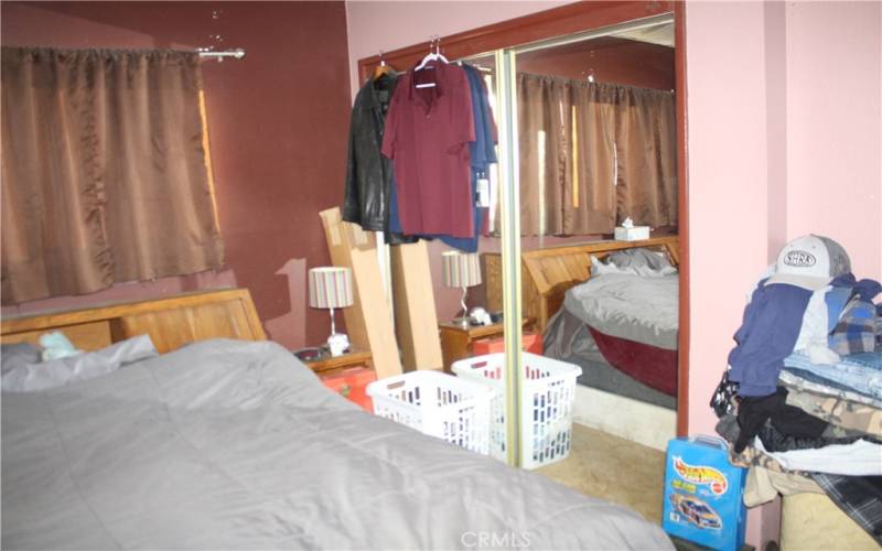 Primary bedroom view from bathroom doorway