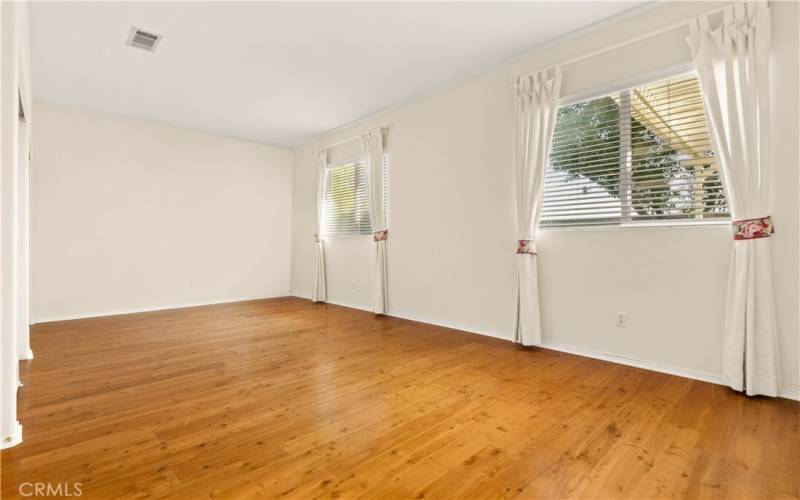 Bedroom 2  or game room with hardwood flooring