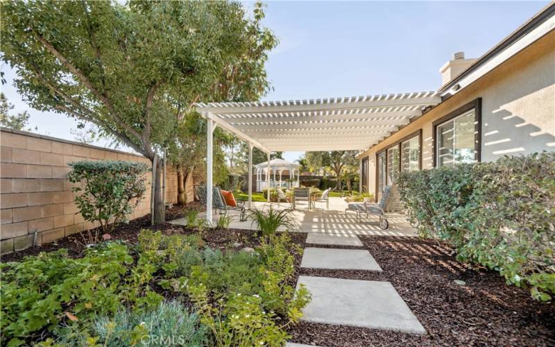 Covered patio and path to side yard