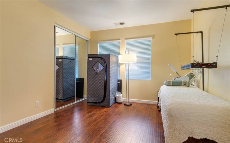 Bedroom #3 with Mirrored Closet Doors Views to Backyard