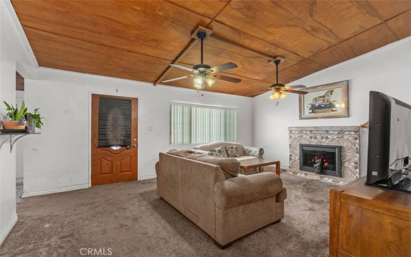 Living Room entrance featuring beautifully tiled fireplace