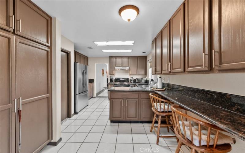 BREAKFAST COUNTER IN KITCHEN AND PANTRY