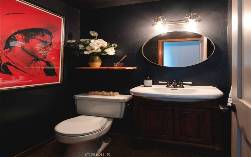 Main level bathroom near the living room and kitchen.