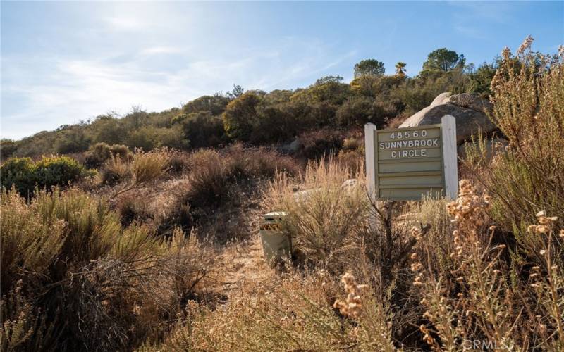 Make left at this sign for entrance via Driveway/Easement to graded pad