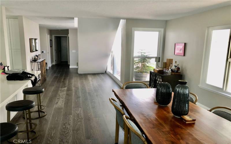 Dining area to entryway and island