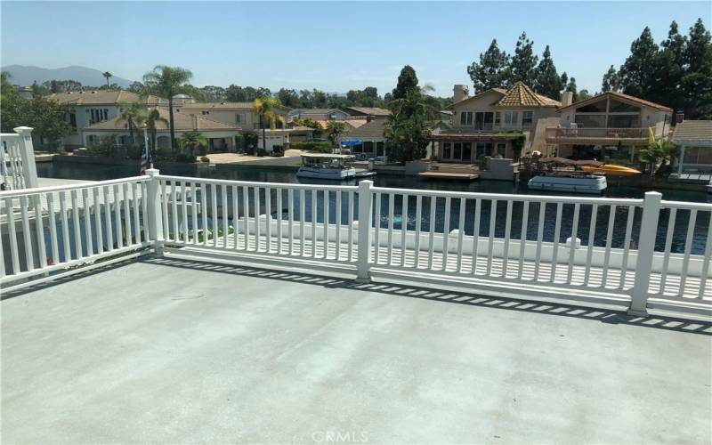 Large deck off main bedroom with views of lake and Saddleback Mountain