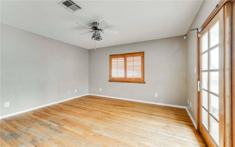 3rd Bedroom with beautiful French doors that lead to backyard/pool area