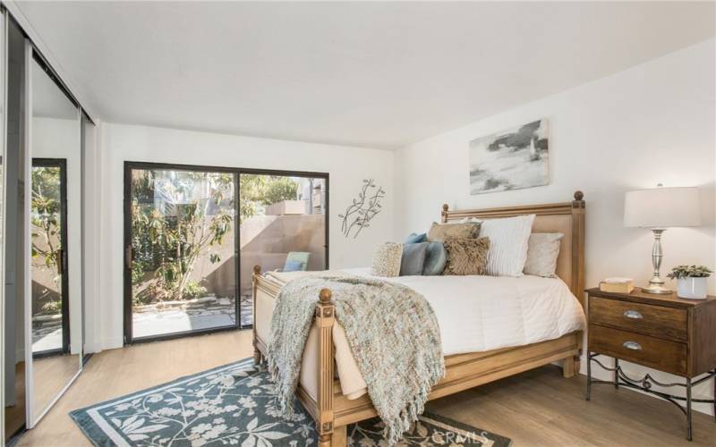 Primary Bedroom also has sliding door access to the back patio.