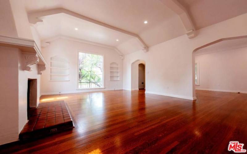 Living room with barrel ceiling and fireplace