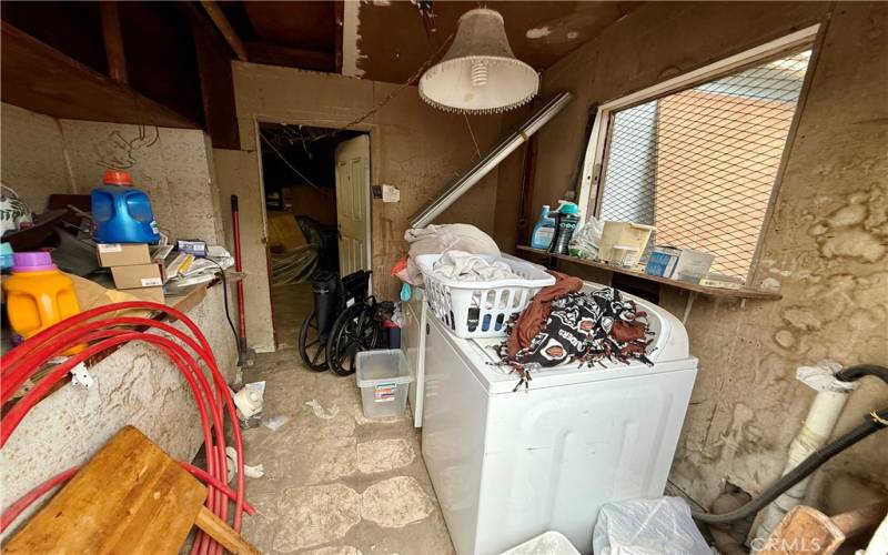 Laundry room attached to garage.