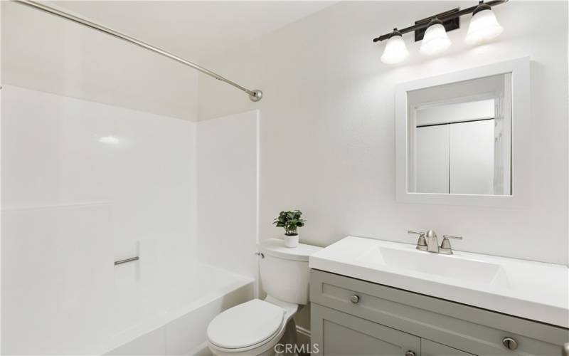 Upstairs has a remodeled bathroom, complete with a shower in the bathtub.