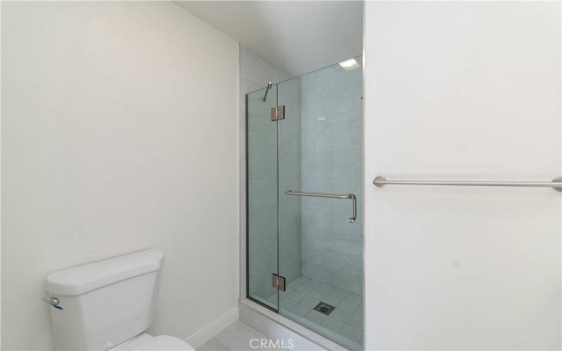 Master bathroom with new frameless shower door