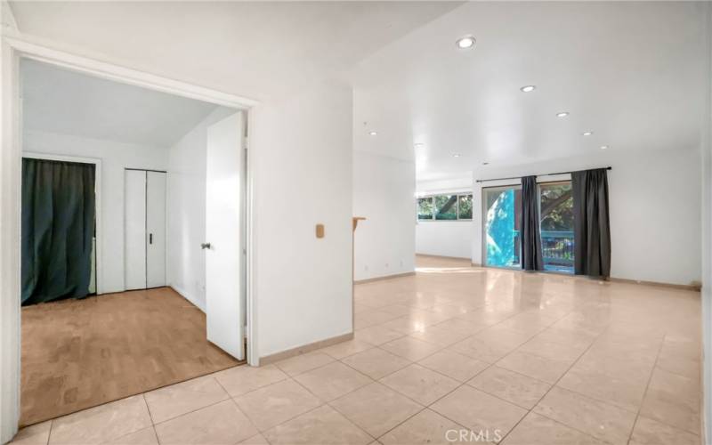 View of 3rd bedroom with washer and dryer /Dining Room/Living Room