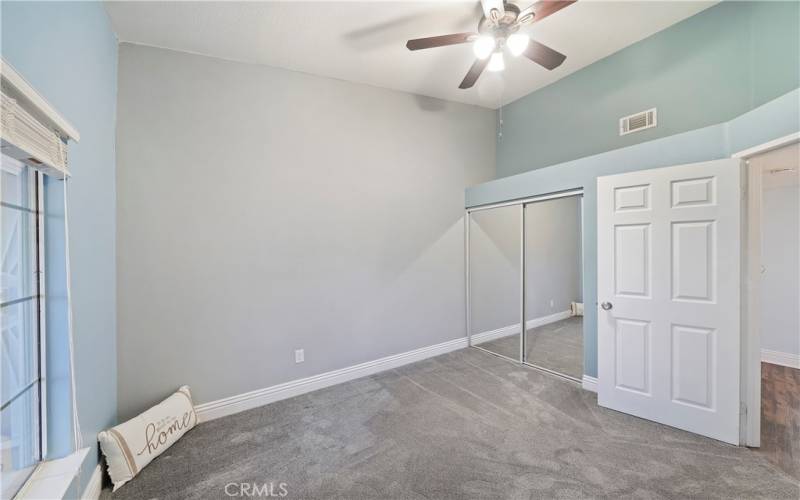 Bedroom 3 of 4, ceiling fan and mirrored closet doors