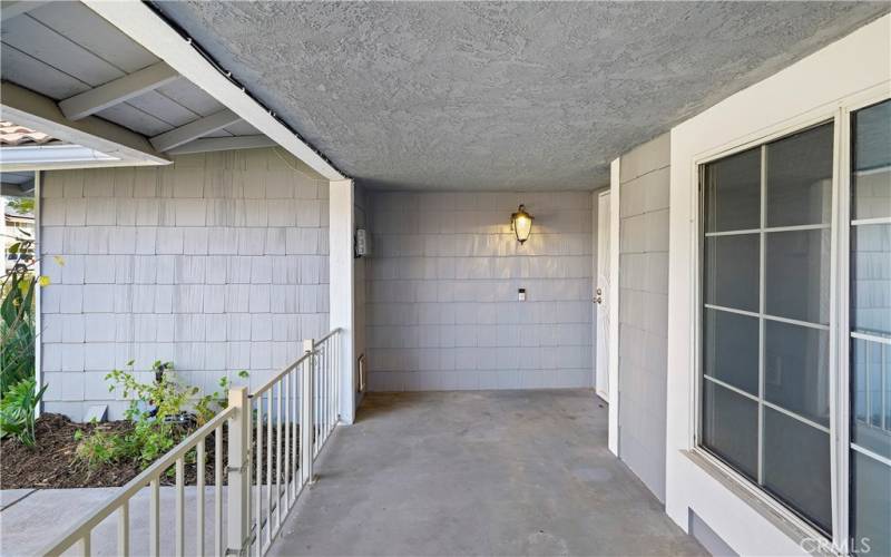 The space is accented by a wall-mounted light fixture.