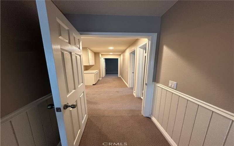 Hallway from bonus room to additional bedrooms.