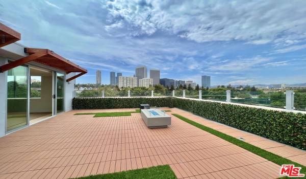 Private rooftop with firepit, BBQ hook up, decking and grass area and spectacular views