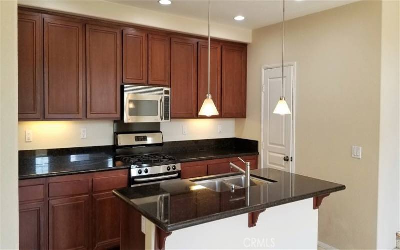 Custom Cabinets, Granite, Lighting and Beautiful Tile Flooring through Kitchen and Dining!