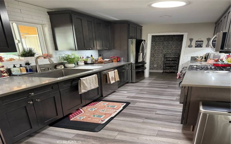 Galley kitchen with large walk in pantry at end