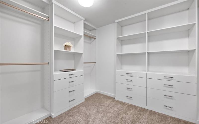 Primary bedroom walk-in closet