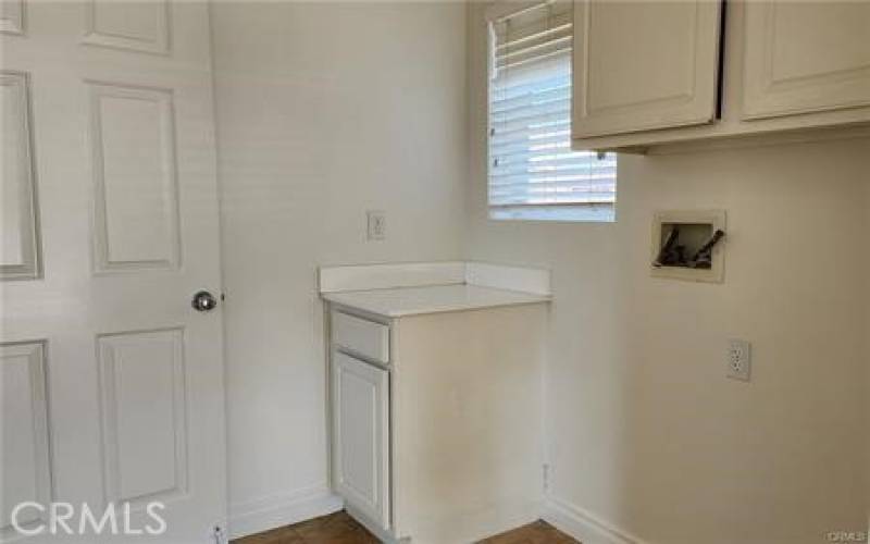 Downstairs Laundry Room with Plenty of Storage