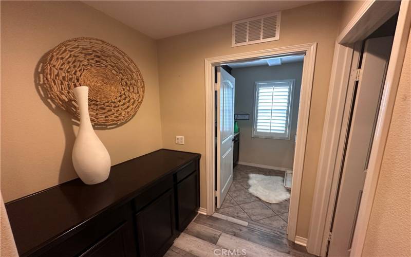 Linen area adjacent to laundry room