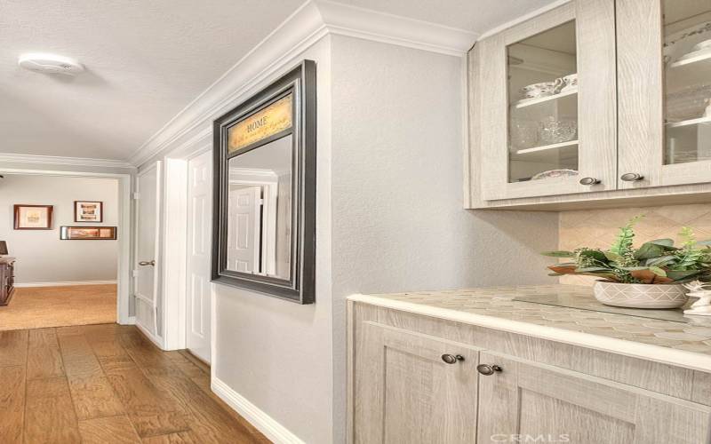 Upgraded hallway storage and display cabinetry.