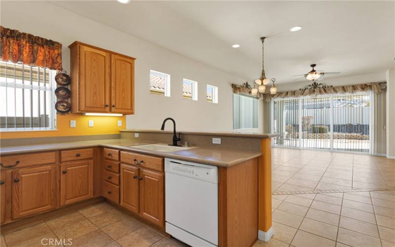 Breakfast bar open to dining area & living room