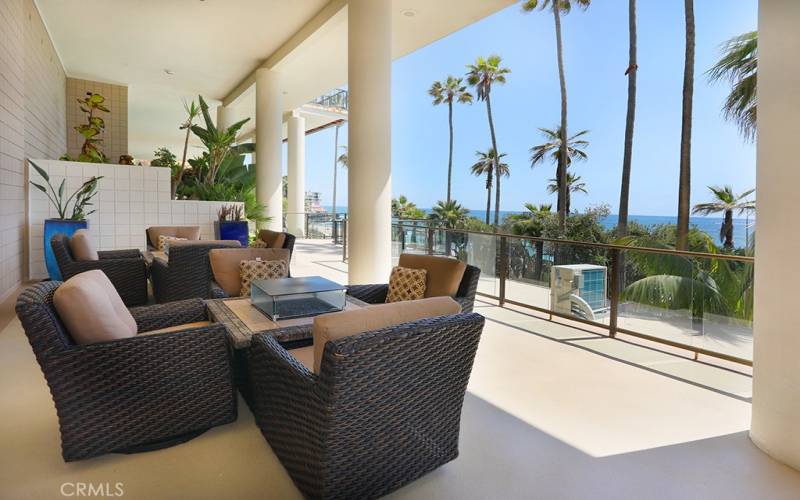 Outdoor sitting area above the pool