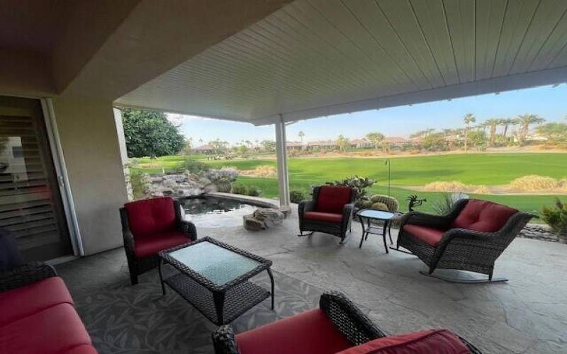 Wide angle rear patio from bbq past spa