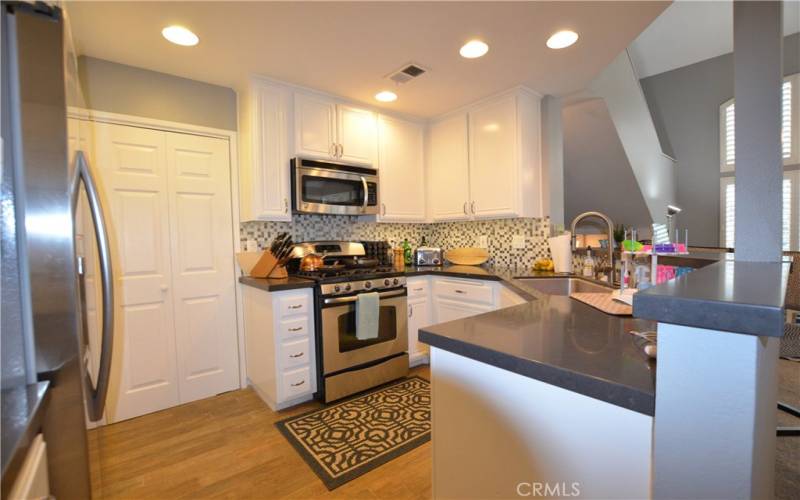 Beautiful wood-look tile flooring.  Closet shown is to the interior laundry room.  Maytag washer and dryer is not shown, but is included.