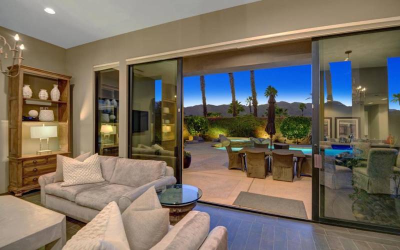 LIVING ROOM TO POOL AND MOUNTAINS NIGHT