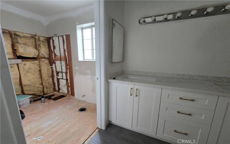 primary bathroom. Under construction. New tub/shower and toilet being installed.