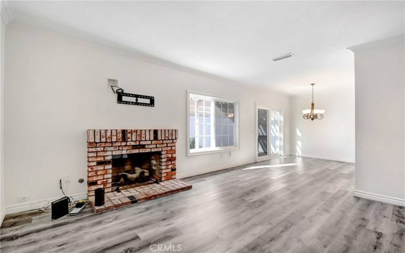 Living Room gas fireplace and slider to the private patio