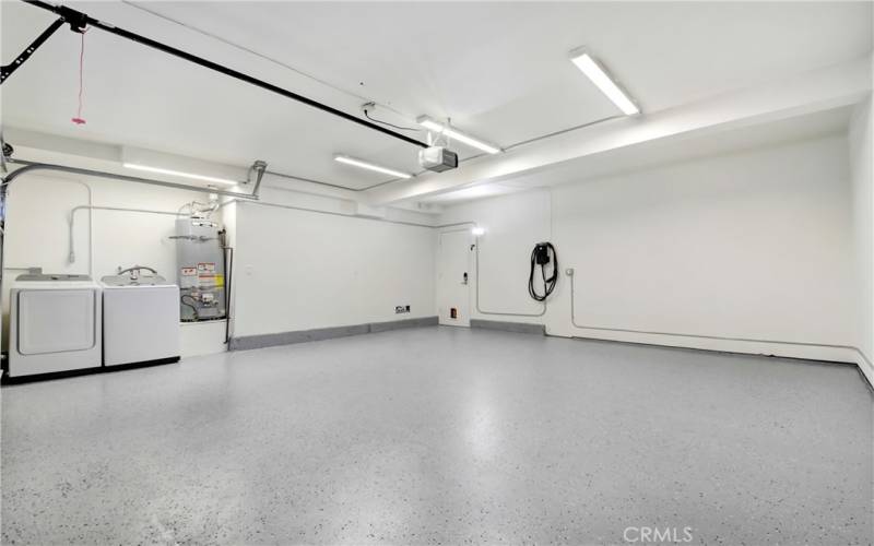 Oversized 2 car garage; new epoxy floors; washer/dryer and EV charging station