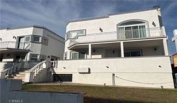 FRONT OF UNIT, (STRUCTURE ON THE RIGHT) REFLECTS PATIO AREA ON FIRST FLOOR, BALCONY ON SECOND FLOOR OFF THE MASTER BEDROOM. (ROOF TOP DECK ON THIRD FLOOR)