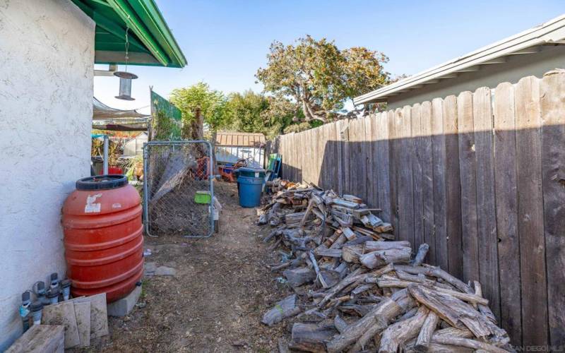 Wood storage for fireplace and composting section.