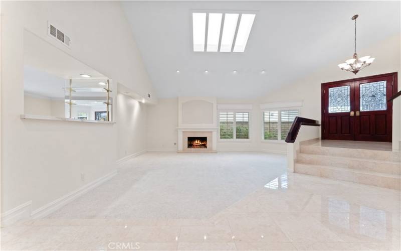 Family room w/ fireplace and skylight