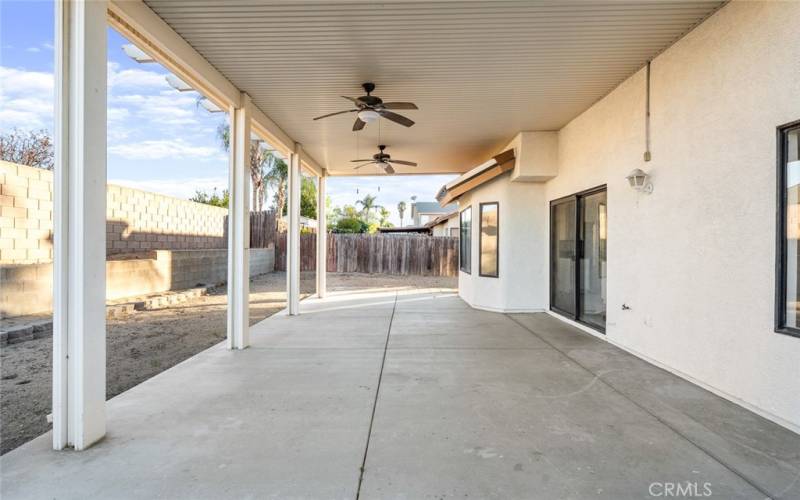 Large covered patio with ceiling fans