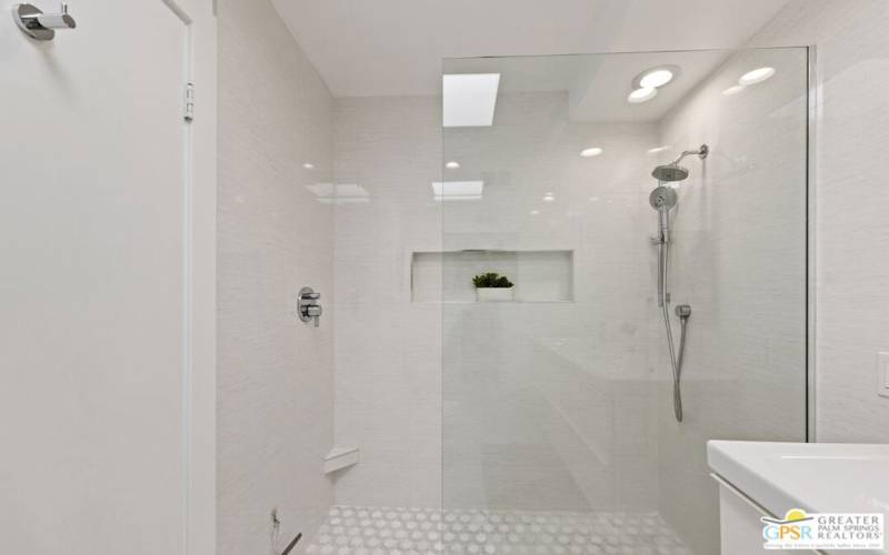 Walk-in shower in the primary bathroom.