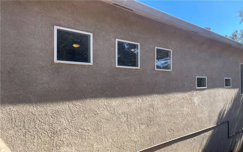 SIDE OF HOME LIVING ROOM WINDOWS