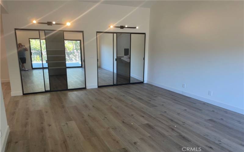 master bedroom with dual walk in closets