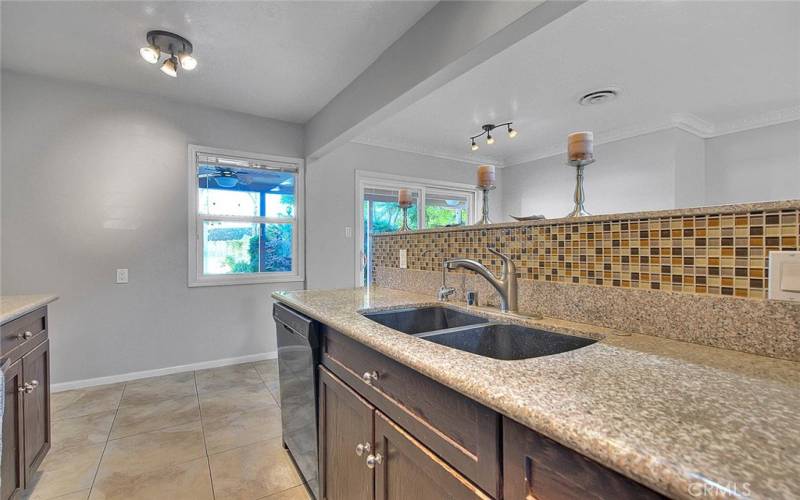 Granite counters and tiled backsplash